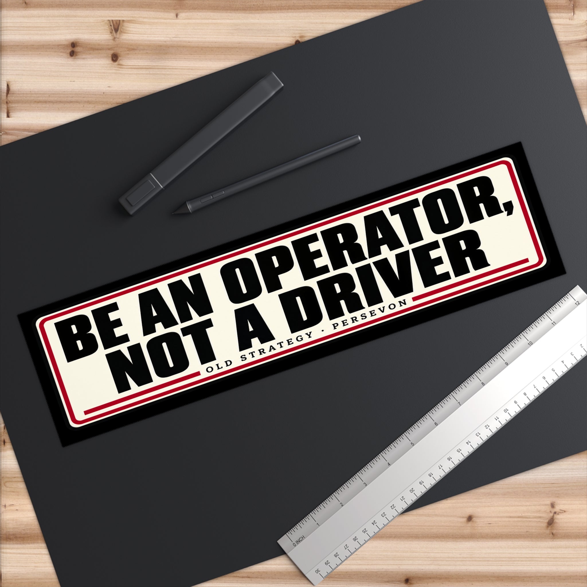 Close-up of Be An Operator Not A Driver vinyl sticker text